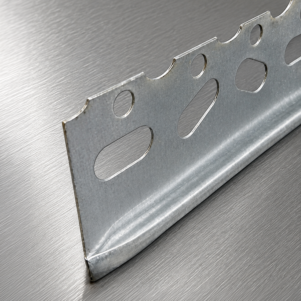 Thin Coat Plaster Stop – Galvanised Galvanised Thin Coat Plaster Stop with perforated fixing holes on a brushed metal background.